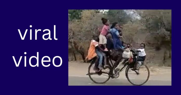 Viral Video Of Man Riding Bicycle With Nine Children